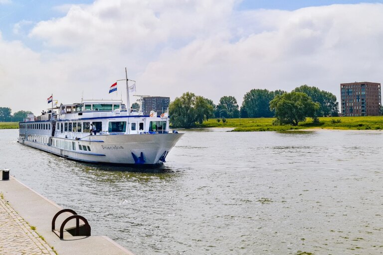 River cruise ship docked along the river in the Netherlands.